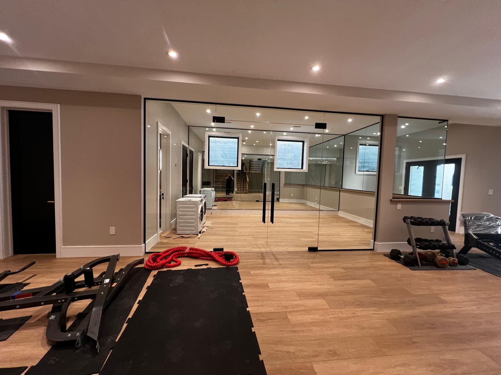 Glass wall and door closing off a home gym