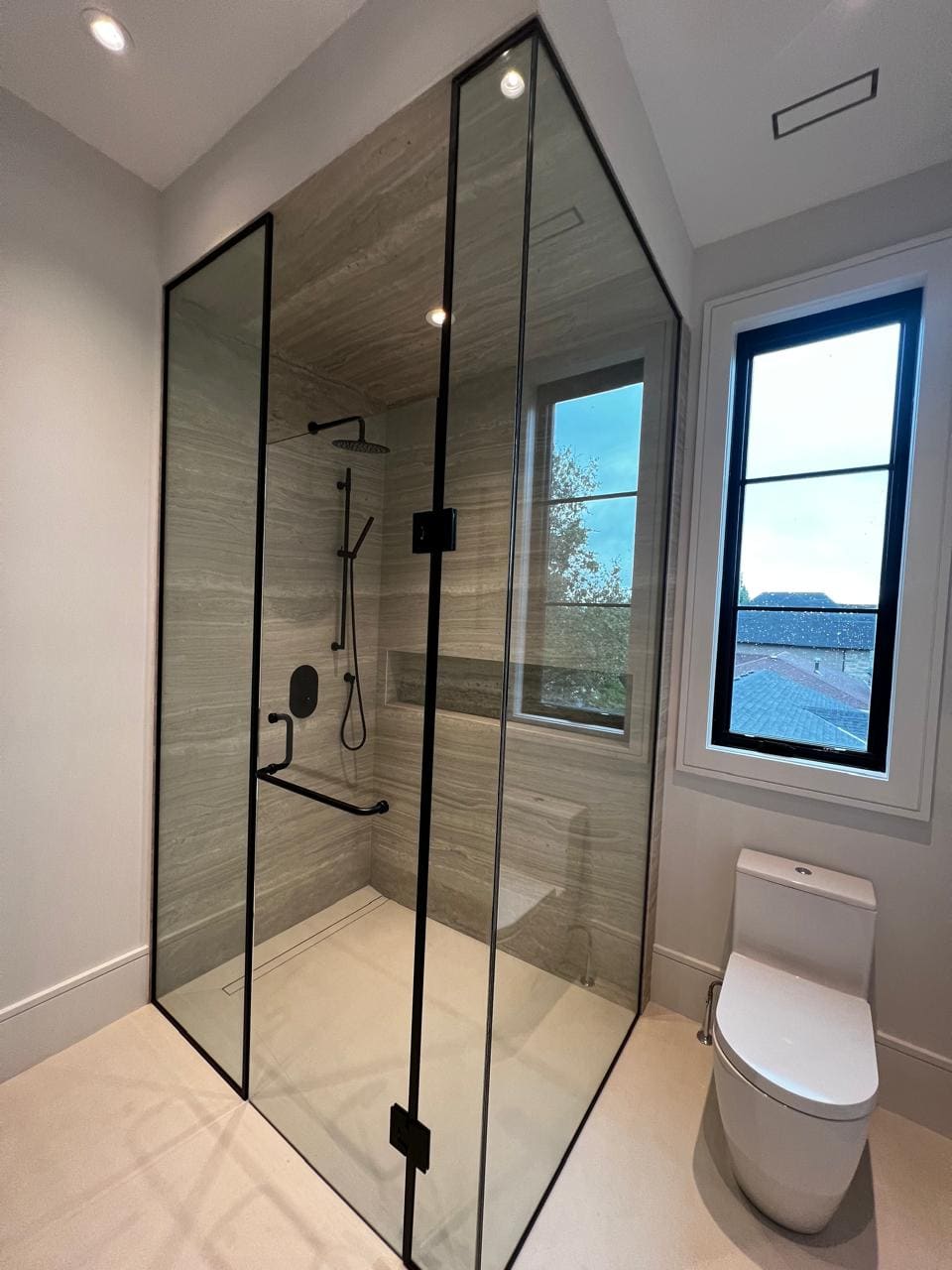 Showers — Frameless, black-framed and neo-angle showers, tub screens and sliding doors, cut and polished in-house and installed plumb.